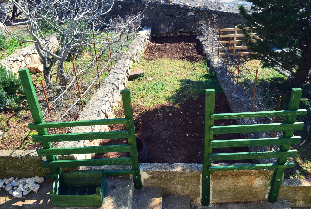 I run out of color for the door. And the composting site in the back looks a bit different now. And more digging to do. But almost there. 